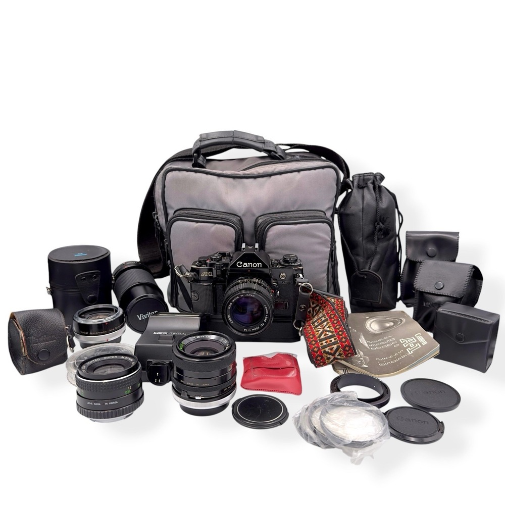 Canon A-1 35mm SLR Film Camera + Bundle Accessories Bag Lenses Powerβ Winder Etc